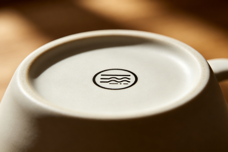 Microwave Safe Ceramic Mug Verification A close-up of the bottom of a ceramic mug showing a microwave-safe symbol