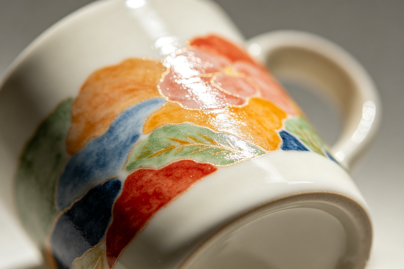 Underglaze vs on-glaze decoration A close-up showing the smooth texture of an in-glaze decorated mug