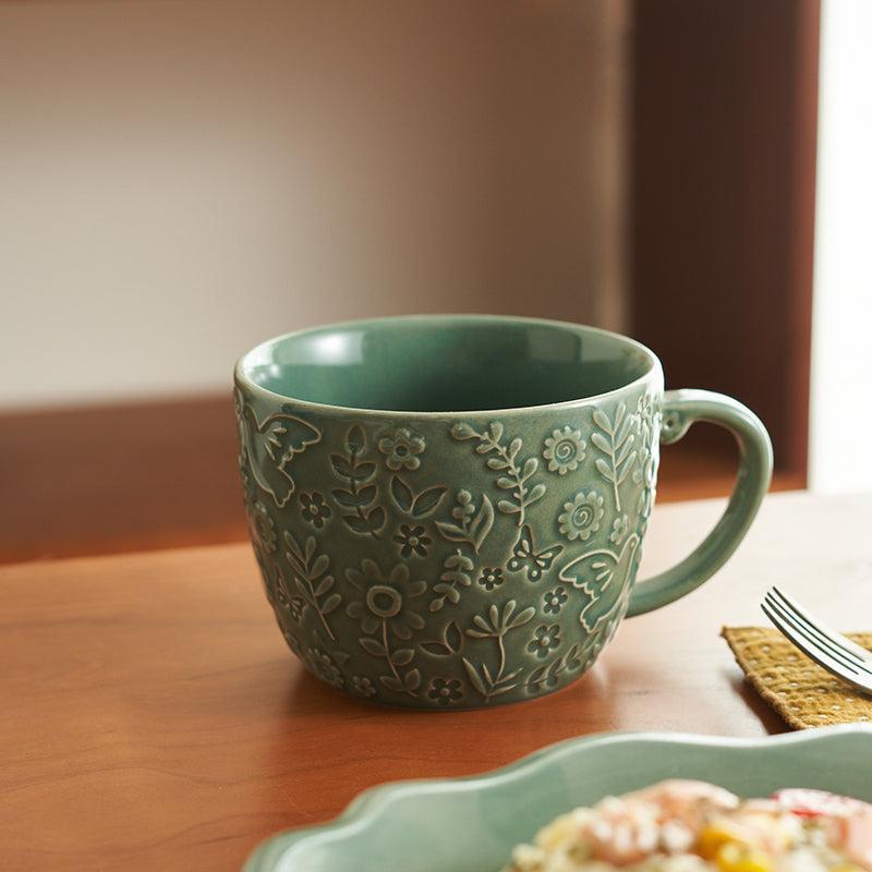 Embossed ceramic mug featuring raised texture and premium craftsmanship