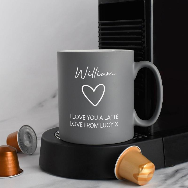 Laser Engraved and Embossed Mugs A close-up shot of a laser-engraved logo on a matte black mug