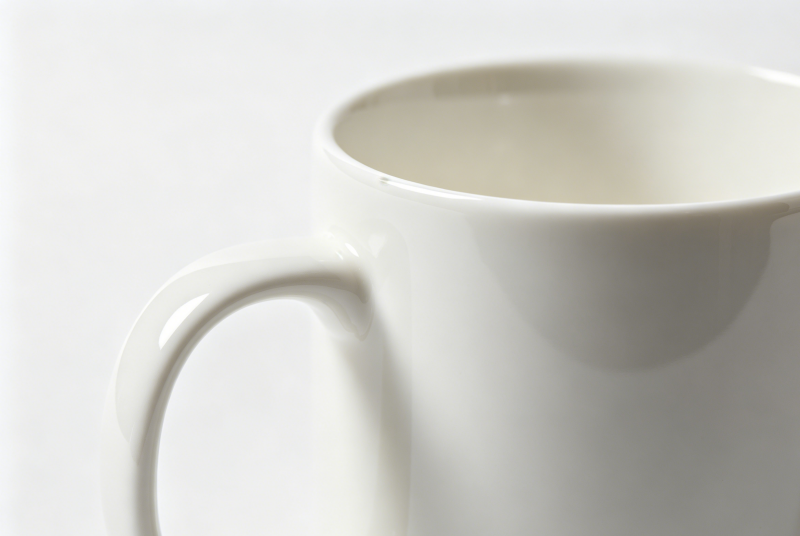 a plain white lead free ceramic mug A collection of mugs with different types of printing