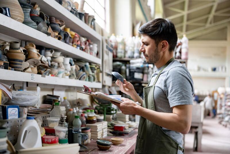 Verifying Ceramic Supplier Claims Buyer reviewing ceramic compliance reports and quality assurance documents